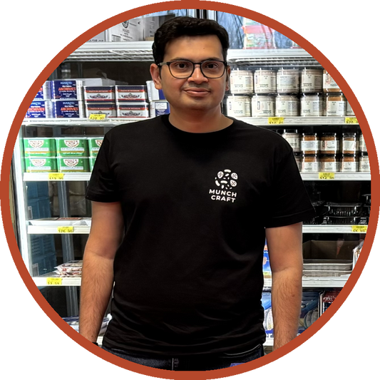 Zubin Kuvadia, founder of Munch Craft, standing in a specialty grocery store
