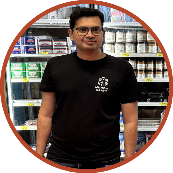 Zubin Kuvadia, founder of Munch Craft, standing in a specialty grocery store